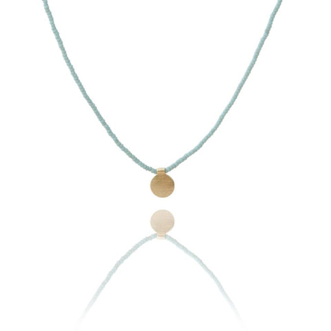 The Makery <br> Short beaded necklace with brushed brass disc <br> SEA FOAM BLUE