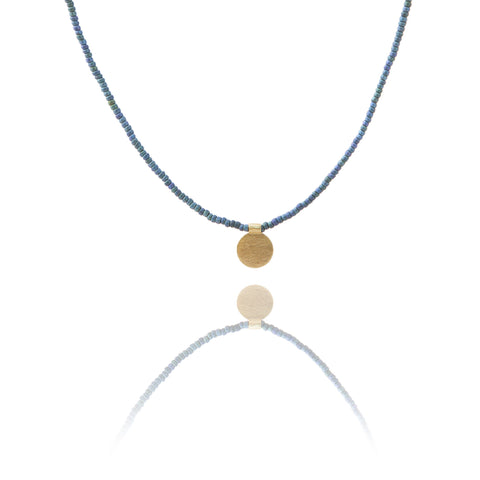 The Makery <br> Short beaded necklace with brushed brass disc <br> METALLIC NAVY BLUE